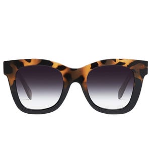 Oversized tortoiseshell sunglasses with gradient lenses offering a stylish and bold appearance.