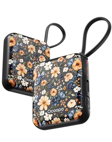 Two portable hand warmers with a floral design and looped handles.