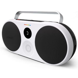 The Polaroid P3 Wireless Boombox features a retro design with a white body and two large black speakers. It includes a carrying handle, modern digital display, and color accents, combining vintage aesthetics with contemporary functionality.