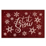 A red doormat with white snowflakes and the phrase \“Let it Snow\“ in cursive font.