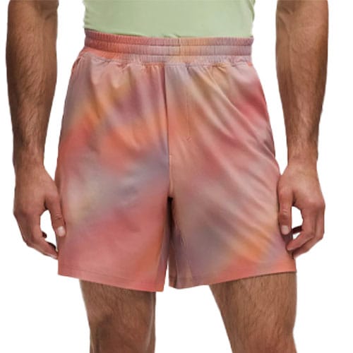 Men's athletic shorts with an elastic waistband, featuring a colorful, tie-dye pattern in shades of orange, pink, and purple.