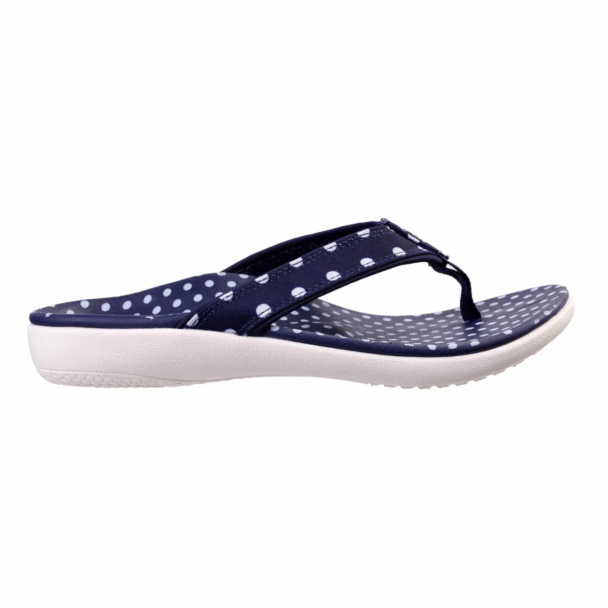 Navy blue flip-flop with white polka dots on the strap and footbed, featuring a cushioned white sole.