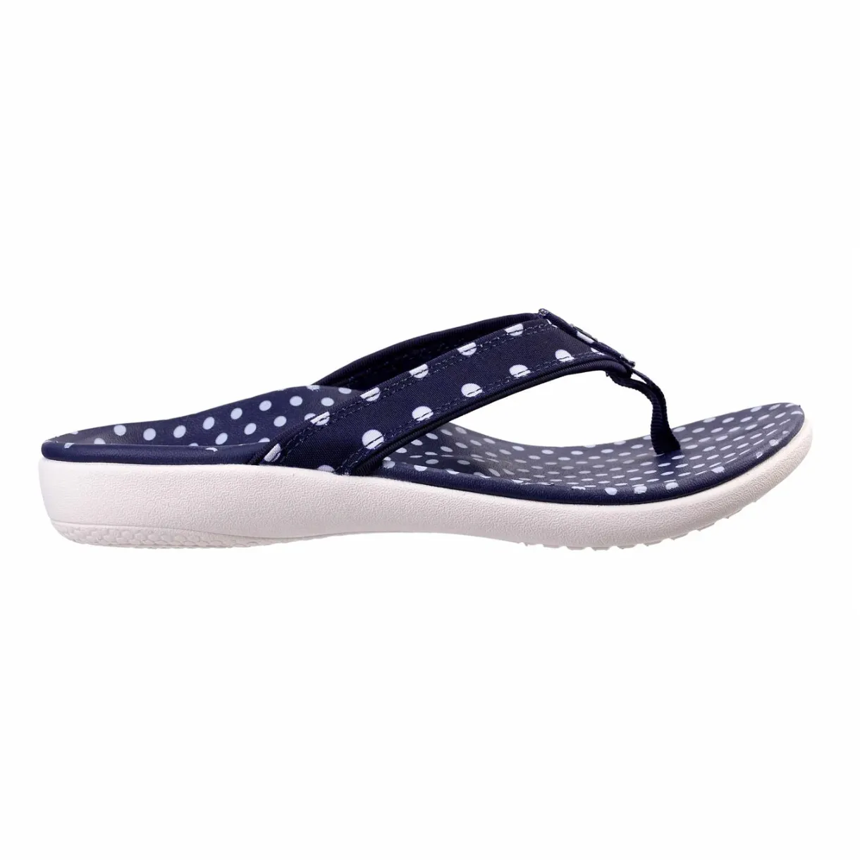 Navy blue flip-flop with white polka dots on the strap and footbed, featuring a cushioned white sole.