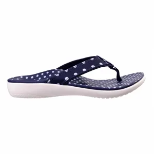 Navy blue flip-flop with white polka dots on the strap and footbed, featuring a cushioned white sole.