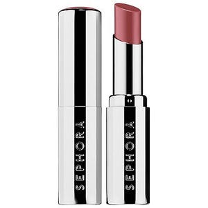 A Sephora branded lipstick with a silver cylindrical case and black accents, showcasing a raised pink lipstick bullet.