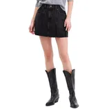 A woman's outfit featuring a gray sweater, black pleated denim mini skirt with front pockets, and black cowboy boots with decorative stitching.