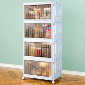 A stackable storage cabinet with transparent drawers houses beverages, canned drinks, and plush toys. The unit is on wheels and has a light blue design against a mint-green wall and wood-patterned floor.