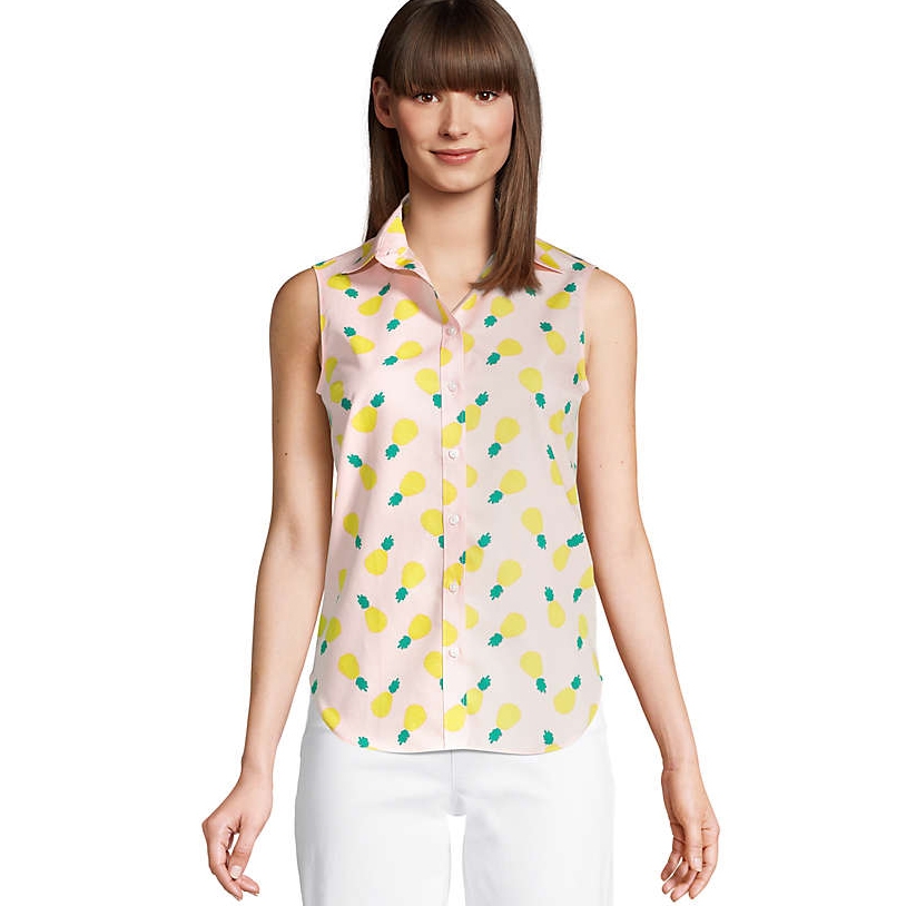 Sleeveless button-up shirt with a pink base and a playful pattern of yellow fruit resembling lemons or pineapples. It features a pointed collar and is paired with white pants.