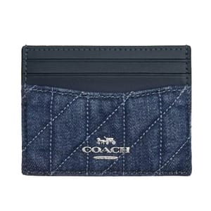 Coach Slim ID Card Case with Quilting features a denim quilted design with a black leather top and several card slots. The Coach logo is displayed in silver on the front.
