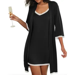 A black nightgown and robe set with white lace trim on the neckline, sleeves, and hem. The robe has three-quarter sleeves, and the nightgown is sleeveless, offering a simple and elegant look.