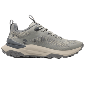 Timberland Motion Access Low Sneakers feature a knit-mesh upper with gray and beige tones, a chunky cushioned sole, and a rugged outsole for traction, showcasing a blend of style and functionality.