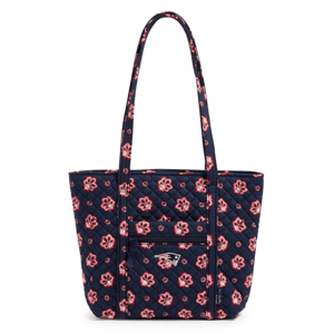 A navy quilted tote bag with a floral pattern and New England Patriots logo, featuring a front zippered pocket and long handles.