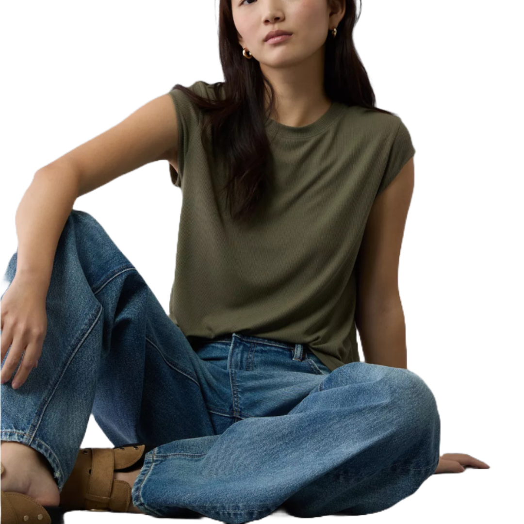 Olive green muscle t-shirt with cap sleeves and a relaxed fit, paired with blue high-waisted jeans and tan sandals.