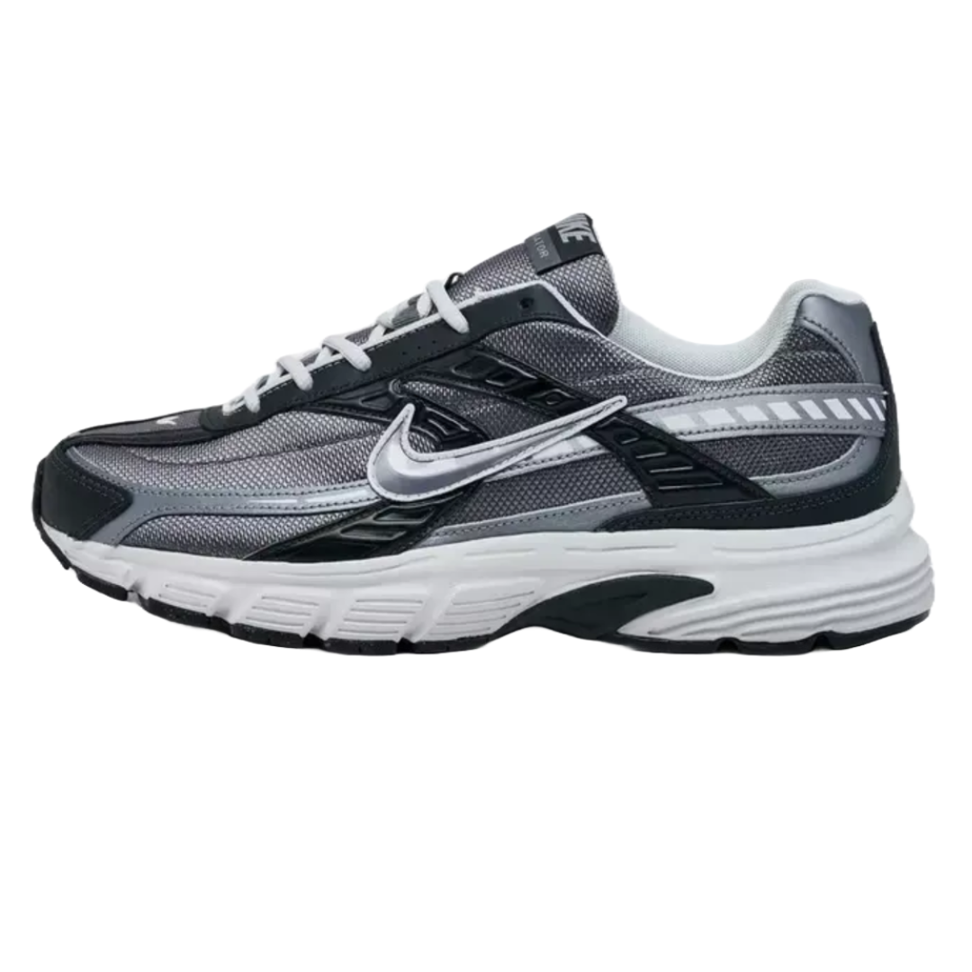 Nike Men's Initiator Running Shoes feature a sleek design with mesh upper for breathability, synthetic overlays for support, a cushioned midsole, and a durable rubber outsole. They are primarily in shades of gray and black with a white swoosh.