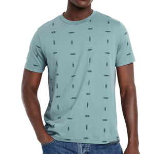 A light blue short-sleeve t-shirt with a scattered small surfboard pattern, paired with blue jeans.