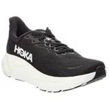 A black HOKA running shoe with a white sole, featuring the brand logo on the side and a mesh upper for breathability.
