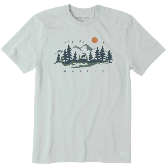 A light-colored T-shirt featuring a scenic design of mountains, trees, a sun, birds, and the word \“UNPLUG\“ below the graphic.