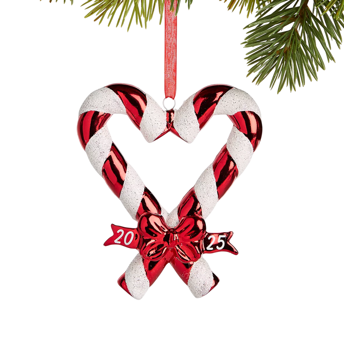 Christmas ornament shaped like a heart made of two candy canes with red and white stripes, featuring a bow and the year \“2023\“ written on it.