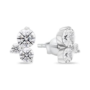 Pair of stud earrings with three round, white gemstones set in a triangular formation on a metal base.