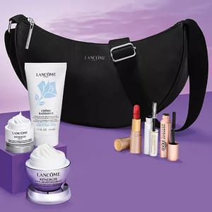 A black Lancôme handbag is paired with skincare and makeup items, including a Crème Radiance cleanser, two Renergie creams, lipstick, mascara, and other cosmetics against a purple background.