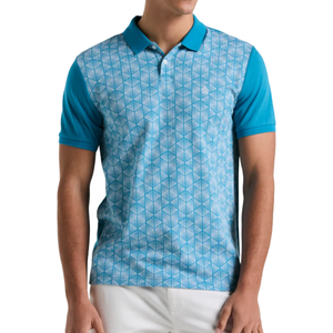 A short-sleeve polo shirt featuring a turquoise geometric pattern on the front with solid turquoise sleeves and collar, paired with white pants.