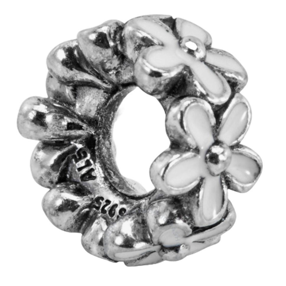 A silver charm with daisies featuring white enamel accents, marked with \“ALE\“ and \“925\“.