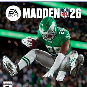 PS5 game cover for \“Madden NFL 26\“ by EA Sports, featuring a football player in a green uniform leaping with a football.