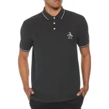 A man is wearing a dark charcoal polo shirt with white piping on the collar and cuffs, featuring a small penguin logo on the left chest.