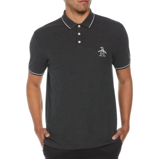 A man is wearing a dark charcoal polo shirt with white piping on the collar and cuffs, featuring a small penguin logo on the left chest.