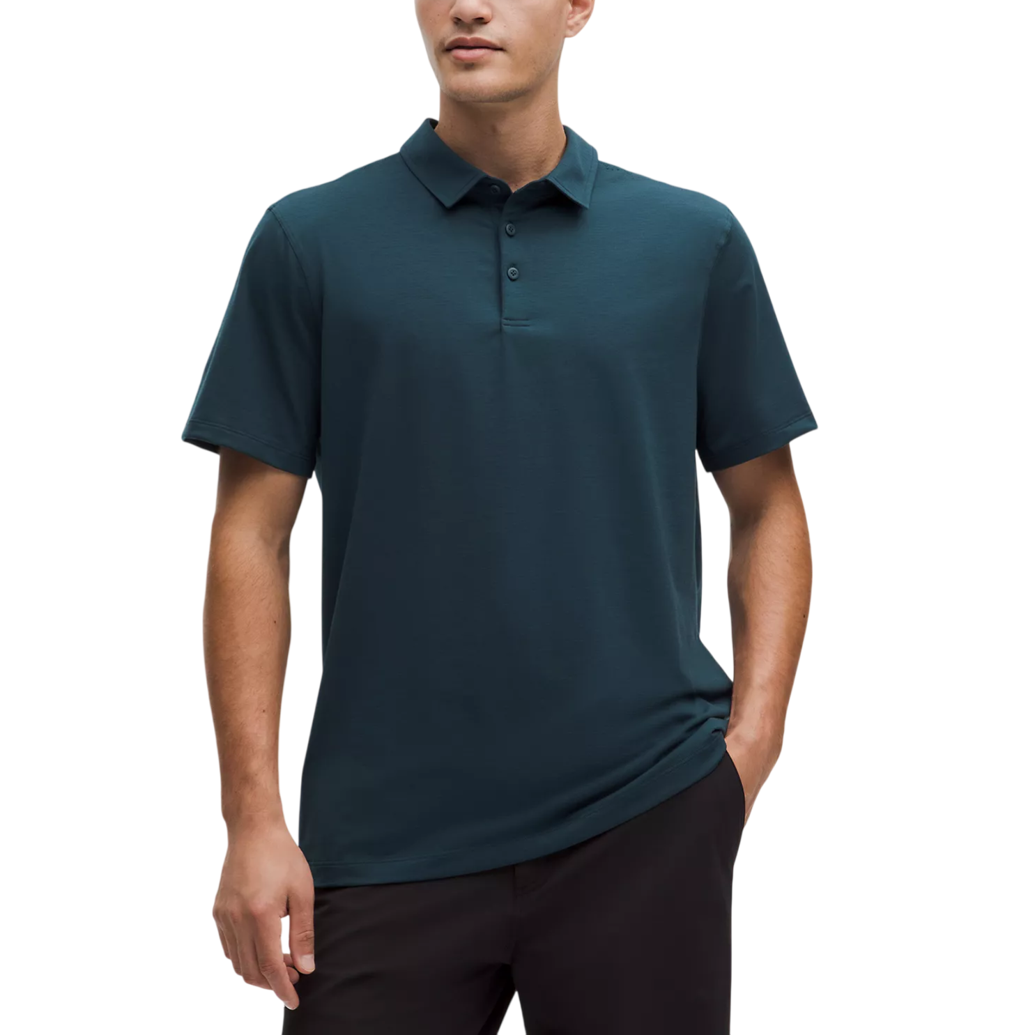 A man wears a dark teal short-sleeve polo shirt with a buttoned collar, paired with dark pants.