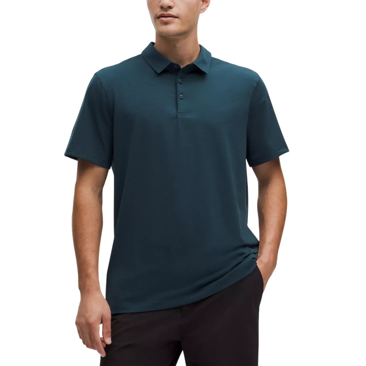 A man wears a dark teal short-sleeve polo shirt with a buttoned collar, paired with dark pants.
