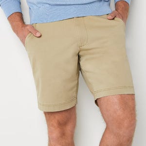 A person wearing tan khaki shorts.