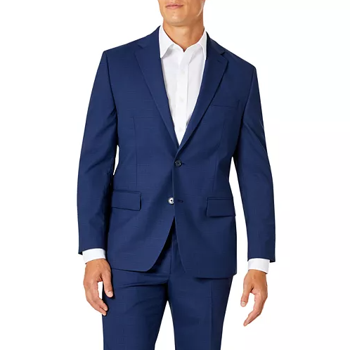 A man wearing a blue suit with a white dress shirt, featuring a two-button jacket and notched lapels.