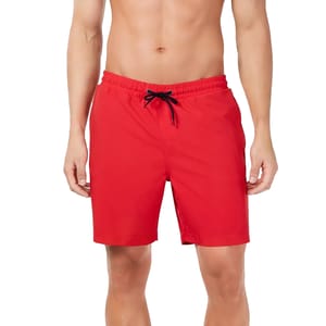 A person wearing plain red swim shorts with an adjustable black drawstring at the waist.