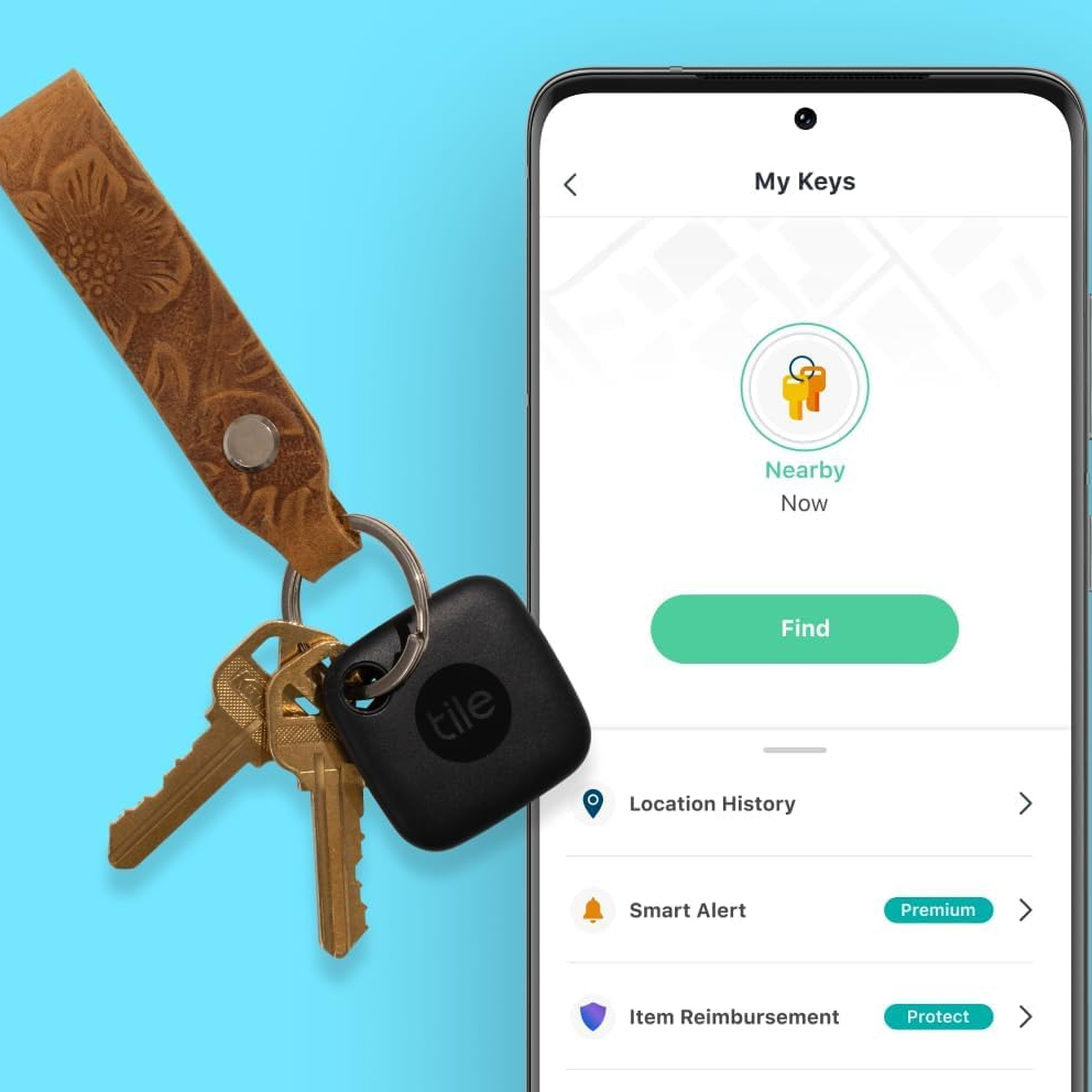 A set of keys attached to a Tile Bluetooth tracker, alongside a smartphone screen displaying the Tile app interface for locating the keys.