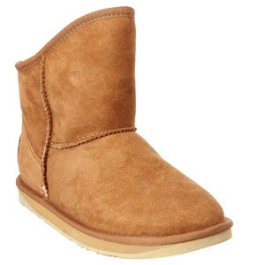 Tan suede boot with a flat sole and mid-calf height, featuring visible stitching and a plush inner lining.