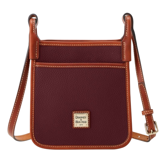 A burgundy crossbody bag with brown leather trim and adjustable strap, featuring a front pocket and a Dooney & Bourke logo.