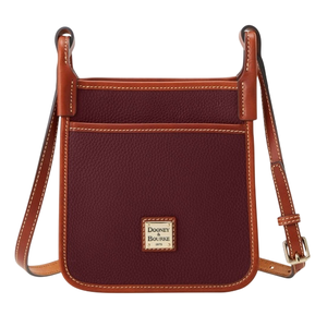 A burgundy crossbody bag with brown leather trim and adjustable strap, featuring a front pocket and a Dooney & Bourke logo.