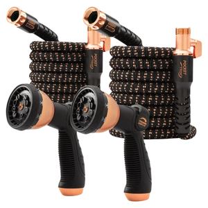 Two expandable garden hoses with black and copper design, featuring spray nozzles with adjustable settings and ergonomic grips.