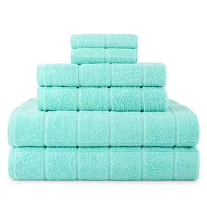 A set of mint-green towels stacked in three sizes: two large bath towels at the bottom, followed by three hand towels in the middle, and topped with two washcloths.