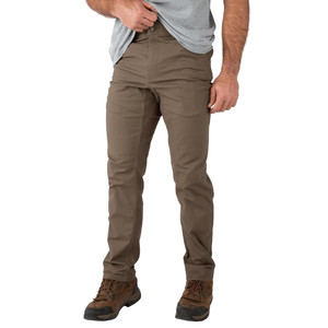 A person is wearing brown pants and brown hiking boots, paired with a gray t-shirt.