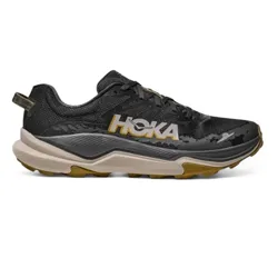 Hoka running shoe with a black upper, gold accents, and a beige and gold midsole.