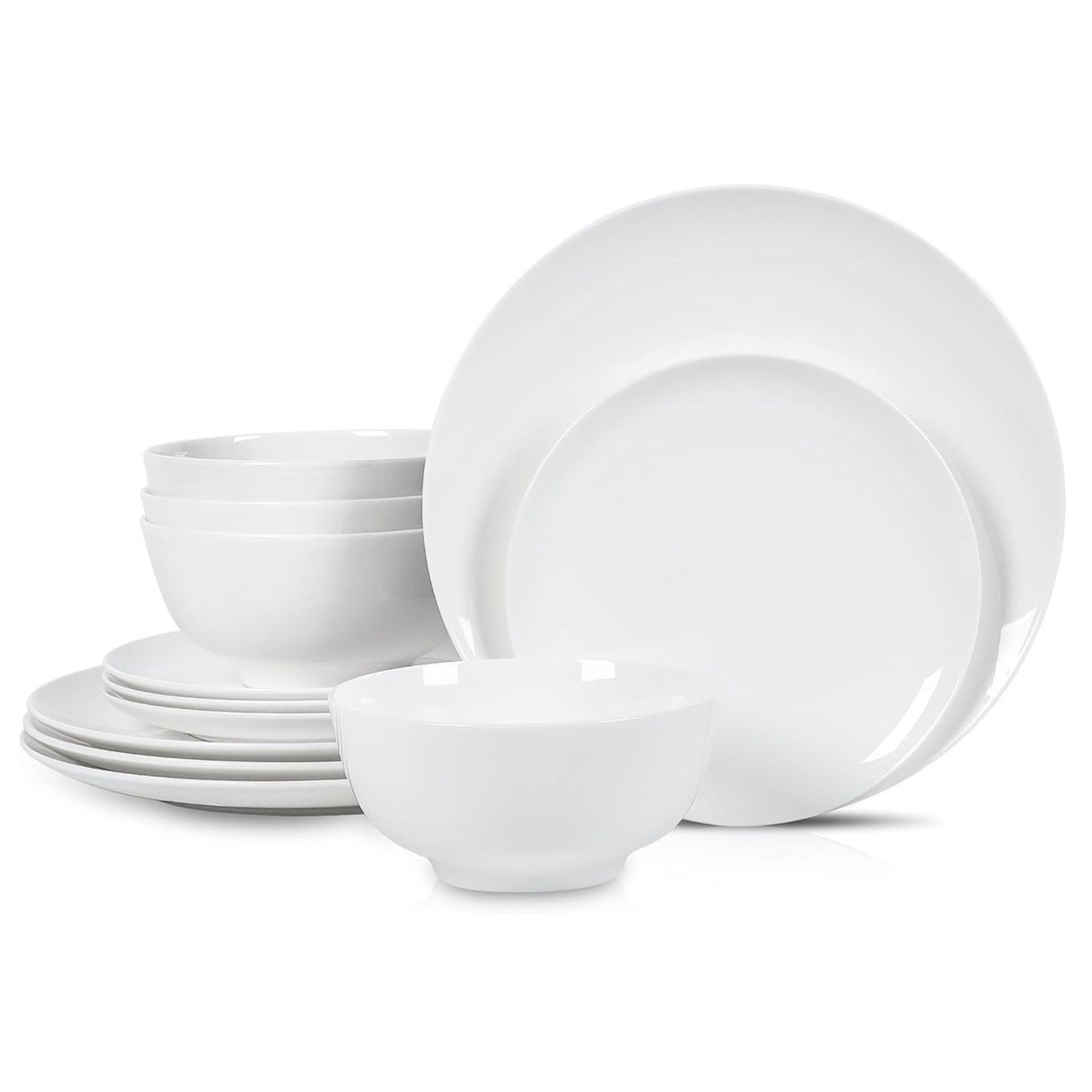 A set of white dinnerware includes plates and bowls stacked together, showcasing a simple and elegant design.