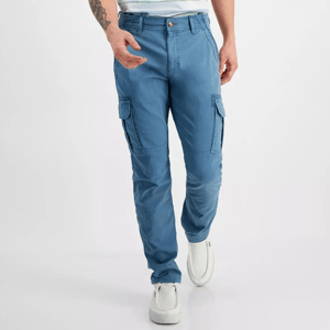 Blue cargo pants with side pockets, worn with white sneakers.