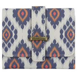 A wallet with a geometric ikat pattern in blue, orange, and white, featuring a flap closure with a brass-colored metal accent.
