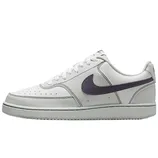 A white low-top sneaker with a black Swoosh logo on the side, featuring white laces and a rubber sole.