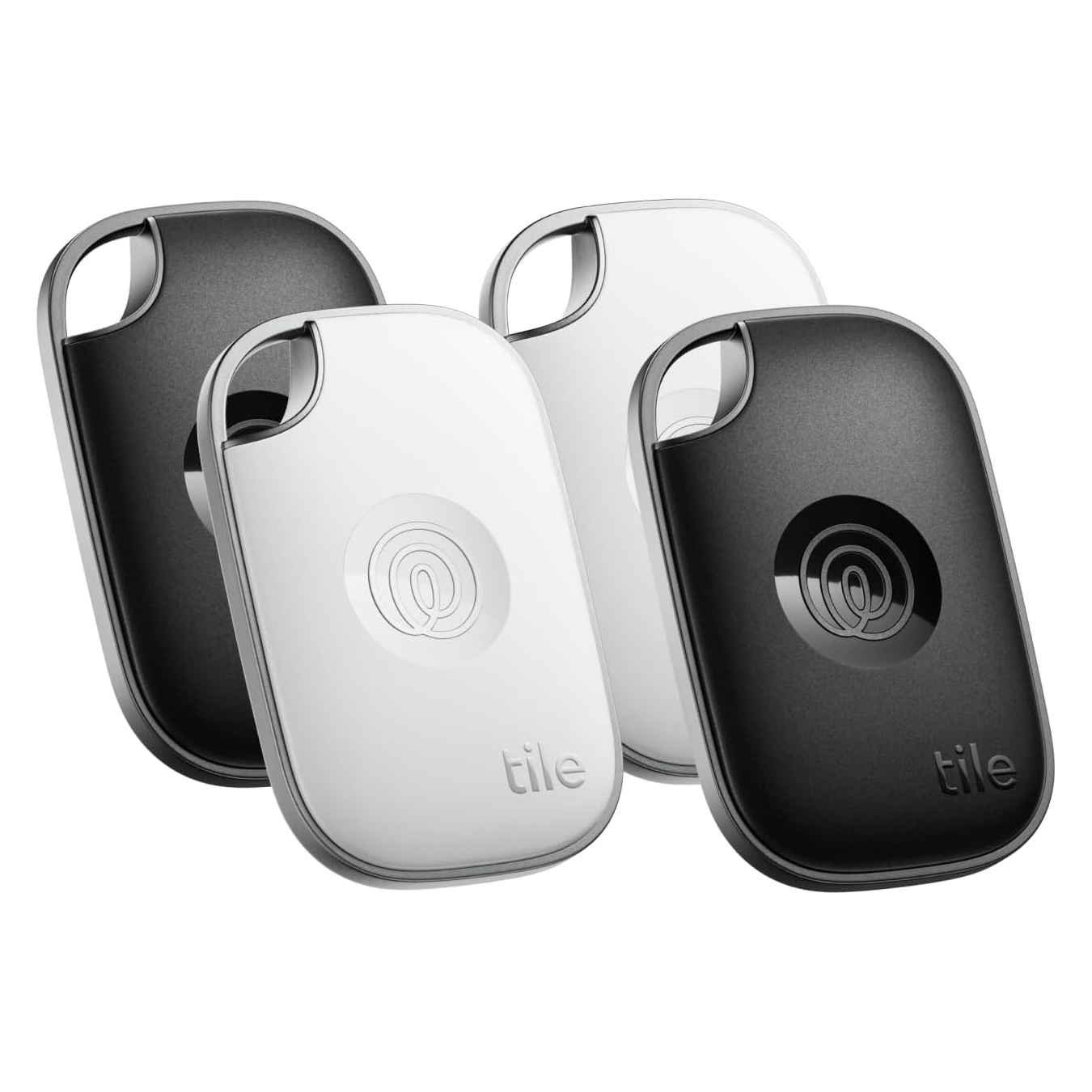 Tile Pro Item Trackers, 4-pack, feature two black and two white keychain devices with a loop for attachment, designed to help locate misplaced items like keys or bags.