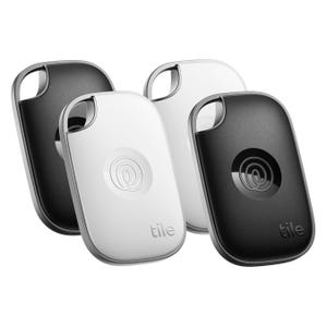 Tile Pro Item Trackers, 4-pack, feature two black and two white keychain devices with a loop for attachment, designed to help locate misplaced items like keys or bags.