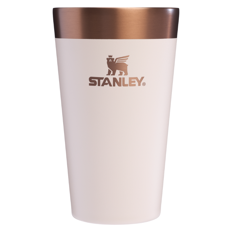 Stanley insulated tumbler with a copper finish at the top and a tan body, featuring the Stanley logo.