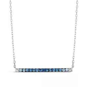 A silver necklace with a horizontal bar pendant featuring a gradient of small blue gemstones from light to dark.